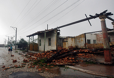 collapsed house as the eye of Hurricane Gustav passes in Los Palacios, 100 km (62.14 miles) west of Havana August 30, 2008.
